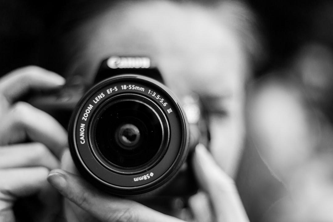 Photographer backing up photos from camera cards to a portable SSD
