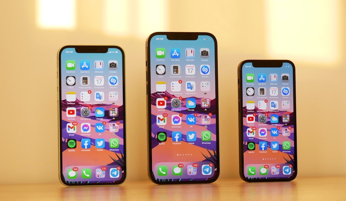 Mous vs OtterBox vs Spigen cases placed on a granite ledge